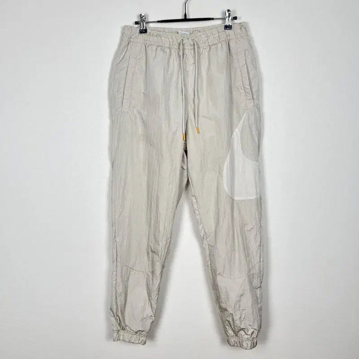 [BUNJANG] Nike Beige Windbreaker Training Pants Men&