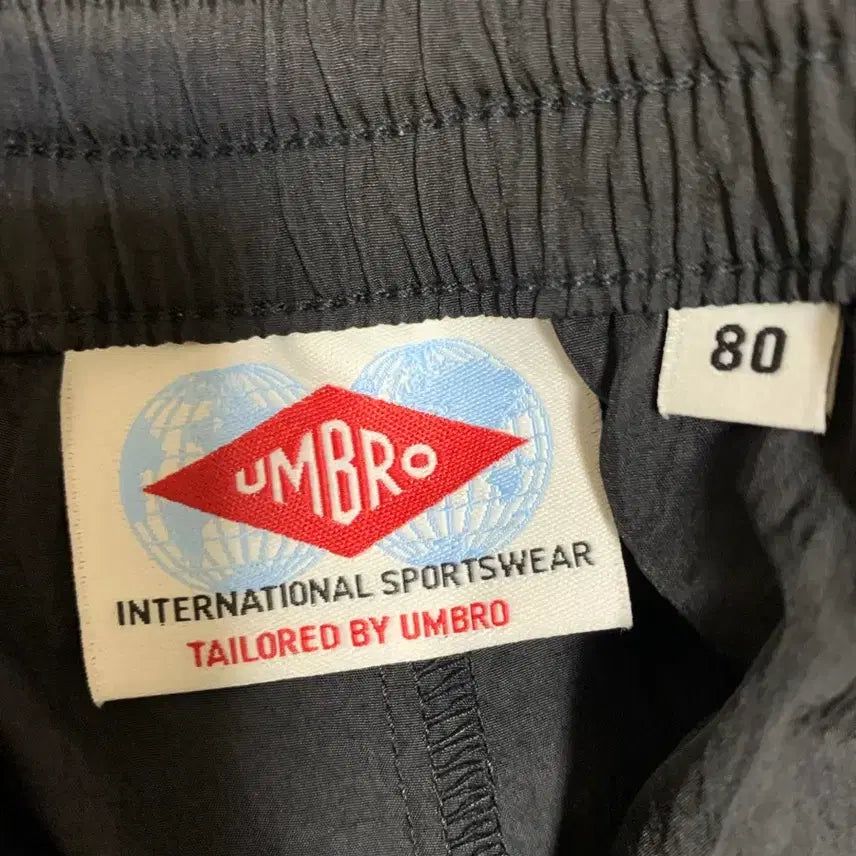 [SOLD OUT] 엄브로 26SS HBL OG 우븐 팬츠