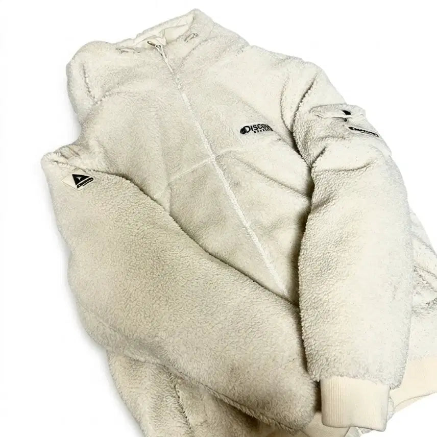 [SOLD OUT] 디스커버리 케이드 플리스 다운 점퍼 크림색상 100