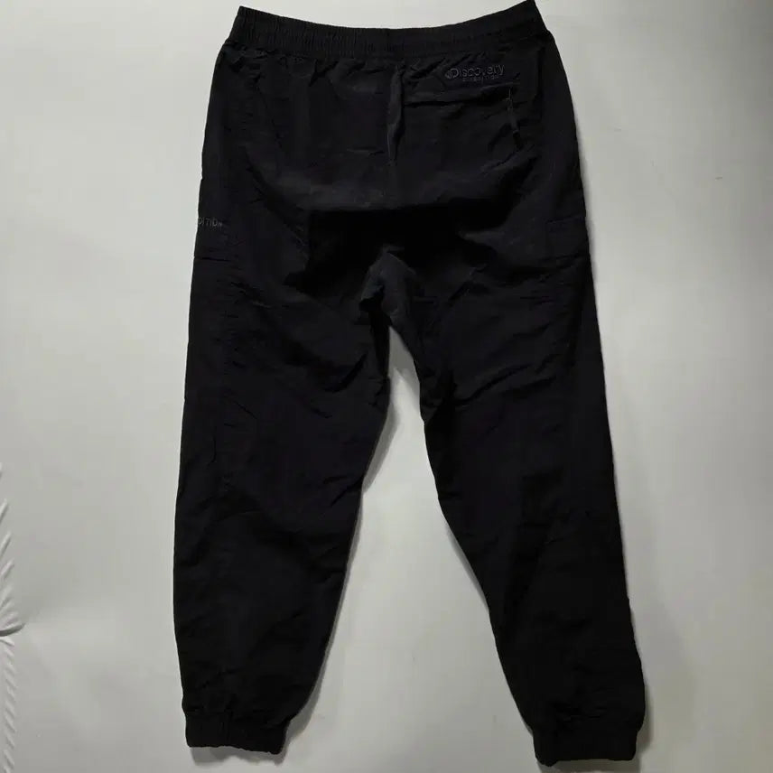 [BUNJANG] Discovery Black Woven Training Pants / 디스커버리 블랙 우븐 트레이닝 팬츠 32 26042413