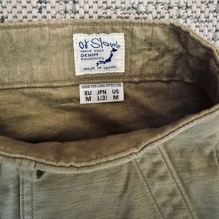 [SOLD OUT] 26SS 오어슬로우 레귤러핏 퍼티그 팬츠 샌드베이지