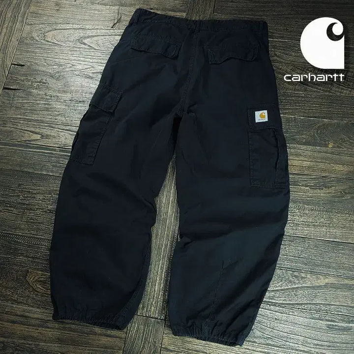[SOLD OUT] 칼하트 윕 로고 패치 와이드 콜 카고 팬츠 블랙 M21272