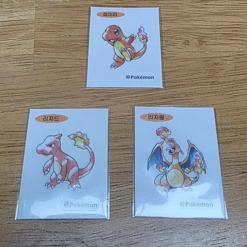 [BUNJANG] Pokemon Stickers Charmander, Charmeleon, Charizard Set 30th Anniversary Artworks First Edition / 포켓몬 띠부씰 파이리 리자드 리자몽 세트 30주년 아트웍스 초판아트 판매