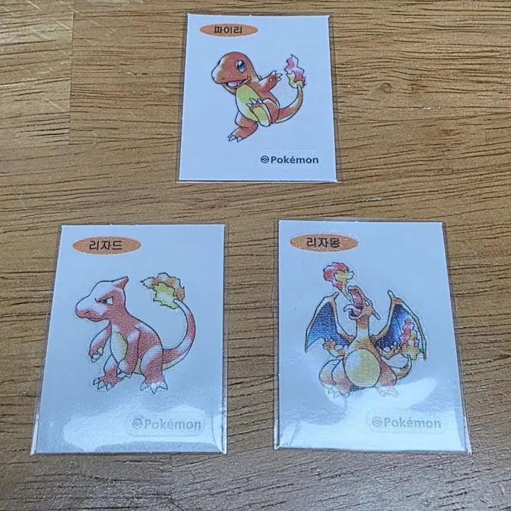 [BUNJANG] Pokemon Stickers Charmander, Charmeleon, Charizard Set 30th Anniversary Artworks First Edition / 포켓몬 띠부씰 파이리 리자드 리자몽 세트 30주년 아트웍스 초판아트 판매